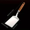 ea9da0ed6eca4f2e68cda854a568c37a_1724495580291.webp Stainless Steel Spatula with Wood Handle